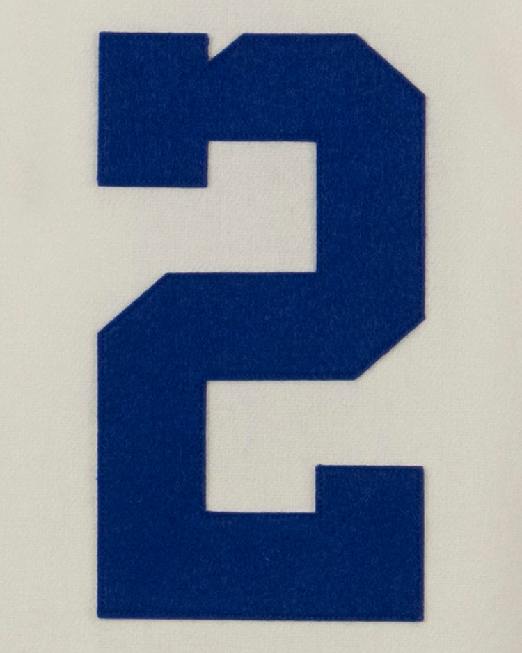 A large, bold blue number 2 is centered on a plain light background, capturing the classic style of an authentic EFF Morgan State University 1975 Home Jersey.