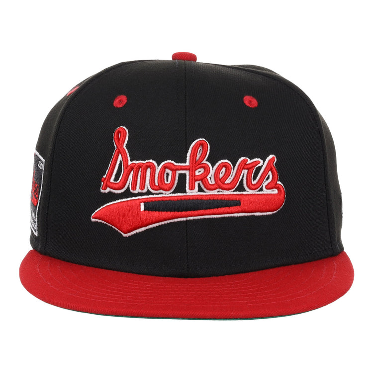 The EFF Tampa Smokers NLB Black and Red Fitted Ballcap features red accents and Smokers embroidered on the front, honoring the historic Tampa Smokers of the Florida International League.