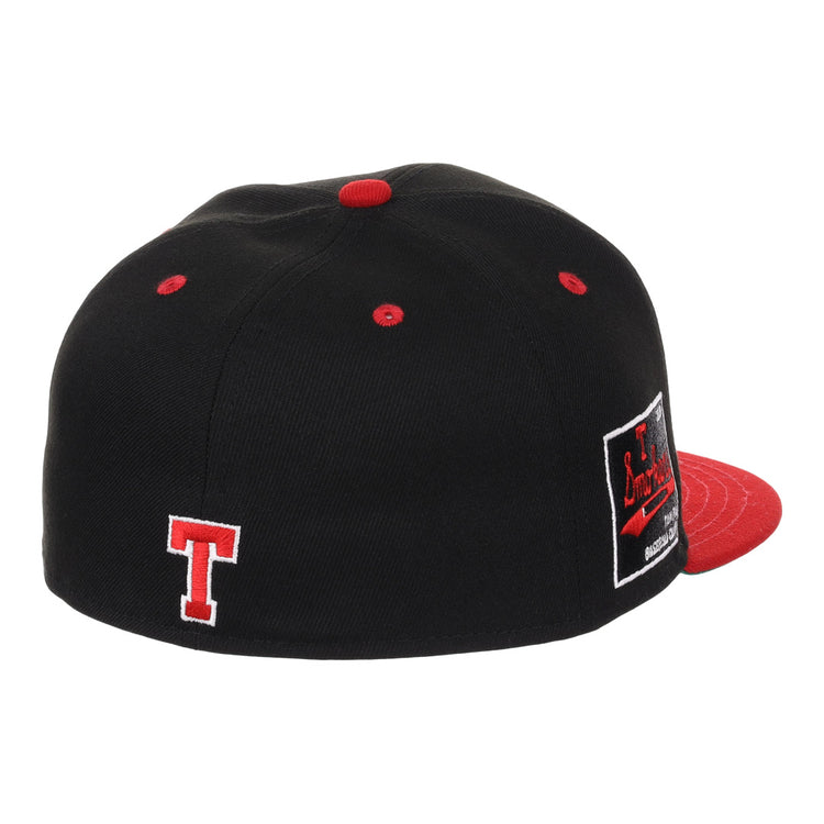 The EFF Tampa Smokers NLB Black and Red Fitted Ballcap features a black crown, red brim, button, and eyelets, a white-outlined red T embroidered on the back, and a black and red side patch inspired by the Florida International League team.