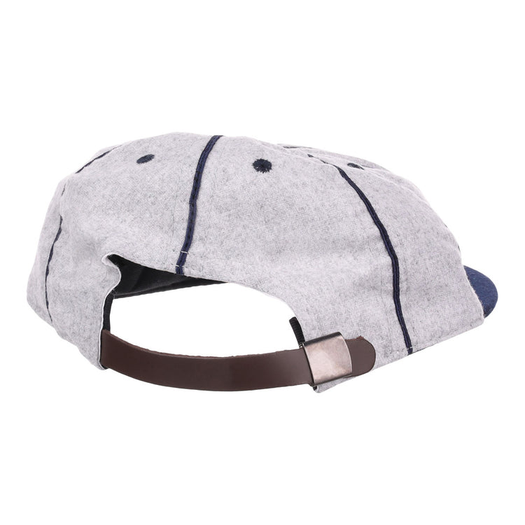 The EFF Columbia Park 1909 Vintage 8-Panel Ballcap is light gray with dark blue stitching, ventilation eyelets, and an adjustable brown leather strap with a metal clasp—perfect for fans of the Columbia Park Boys Club.