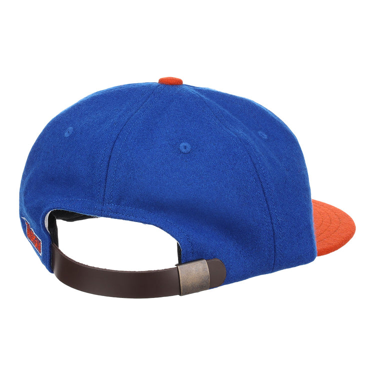 The EFF Morgan State University 1975 Vintage Ballcap is blue with an orange brim and button, shown from the back. It features a dark brown adjustable strap with a metal clasp for comfort and style.