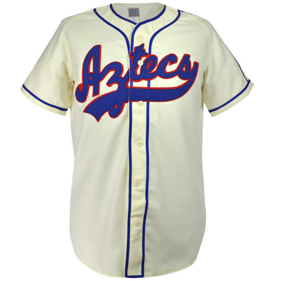 The EFF Mexico City Aztecs 1946 Home Jersey is cream-colored with blue piping, Aztecs in red and blue script across the chest, button front closure, and classic short sleeves.