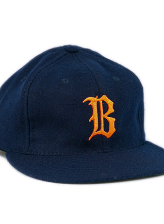 The EFF Bucknell University 1965 Vintage Ballcap is a navy wool flat-brim hat with a bold orange B on the front, made in the USA.