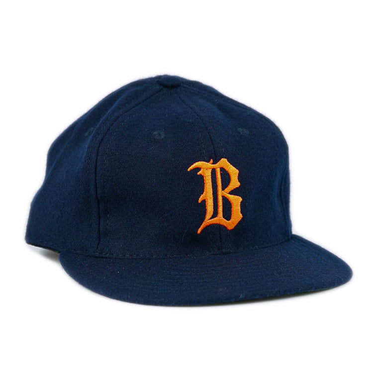 The EFF Bucknell University 1965 Vintage Ballcap is a navy wool flat-brim hat with a bold orange B on the front, made in the USA.