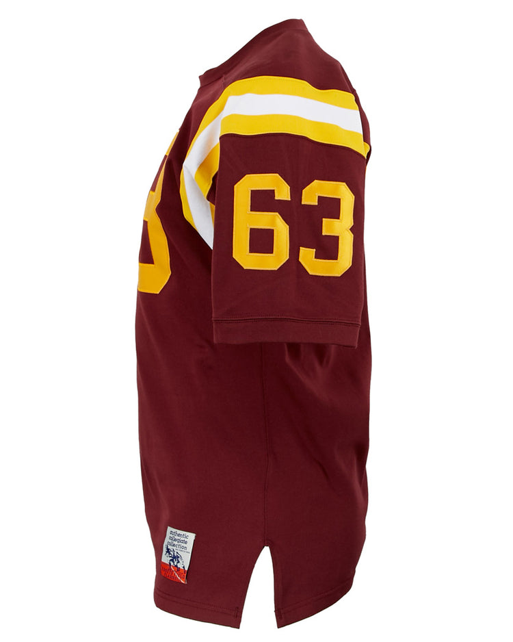The EFF Boston College 1963 Durene Football Jersey is maroon with yellow and white shoulder stripes, a yellow number 63 on the sleeve, and a patch near the hem. Shown from a side view.