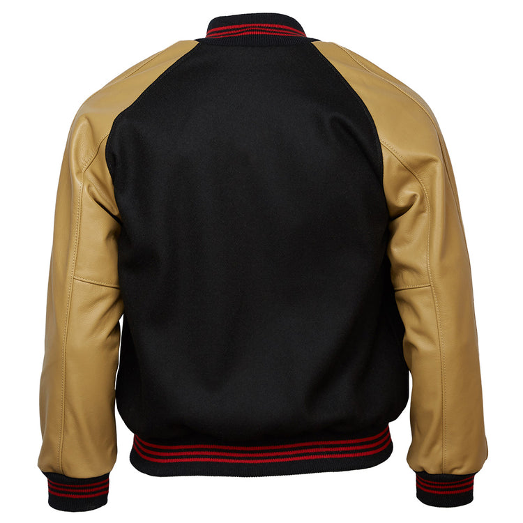 The EFF Chicago American Giants 1936 Authentic Jacket is a black Negro League varsity jacket with tan leather sleeves, black collar, and black waistband and cuffs with red stripes, shown from the back.