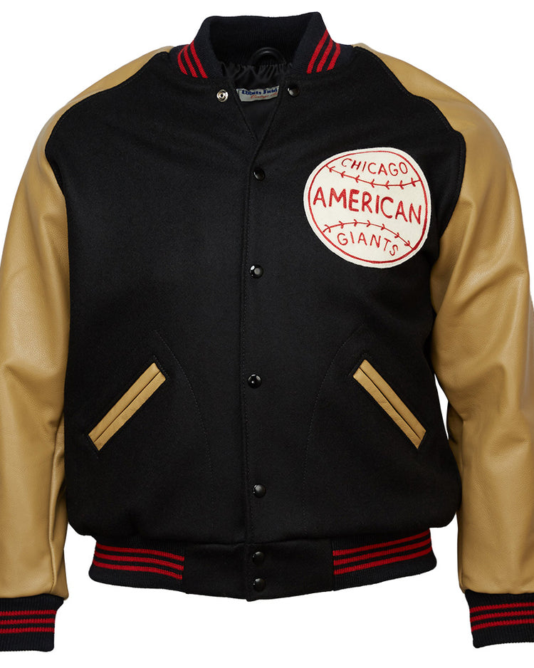 The EFF Chicago American Giants 1936 Authentic Jacket is black with tan leather sleeves, tan-trimmed pockets, red/black striped cuffs and collar, and a large team patch on the left chest.