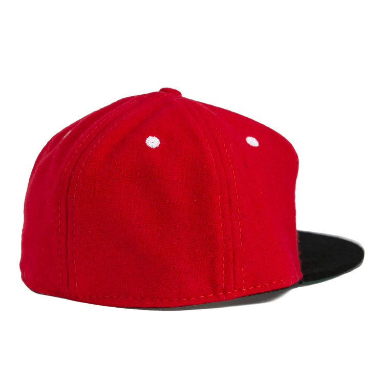 The University of Cincinnati 1960 Vintage Ballcap by Ebbets Field Flannels features a red body with white stitched dots and a black flat brim, authentically reproduced and shown from back and side against a white background.