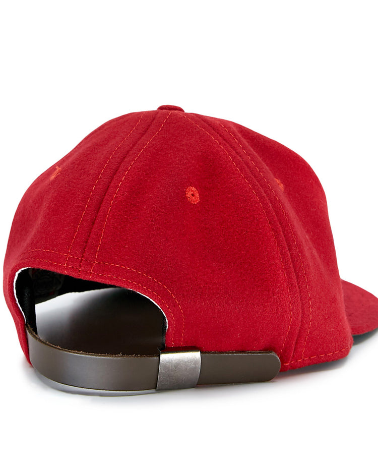 The Daiei Stars 1949 Vintage Ballcap by EFF is shown from the back in red, featuring a brown adjustable strap with a silver buckle and white seam stitching, all set against a plain white background.