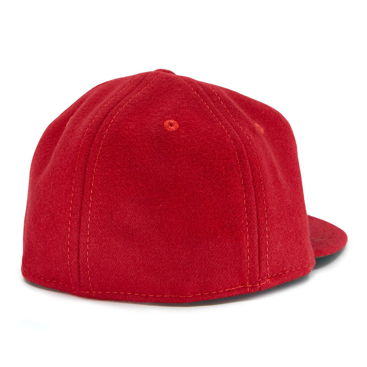 The EFF Daiei Stars 1949 Vintage Ballcap is shown from the back, featuring red fabric, visible stitching and eyelets, with a black underside of the brim peeking out on the right—evoking classic Nippon Professional Baseball style.
