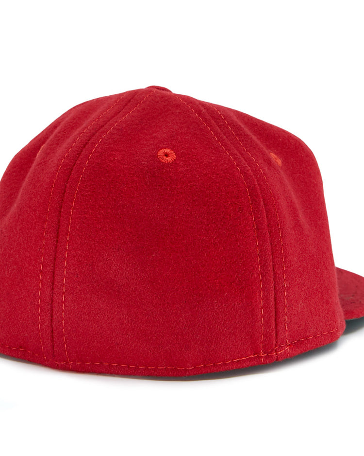 The EFF Daiei Stars 1949 Vintage Ballcap is shown from the back, featuring red fabric, visible stitching and eyelets, with a black underside of the brim peeking out on the right—evoking classic Nippon Professional Baseball style.