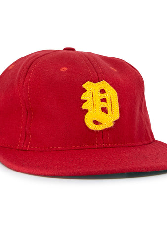 The EFF Daiei Stars 1949 Vintage Ballcap is a red, Nippon Professional Baseball-style hat with a structured crown, flat brim, and large yellow embroidered D on the front.
