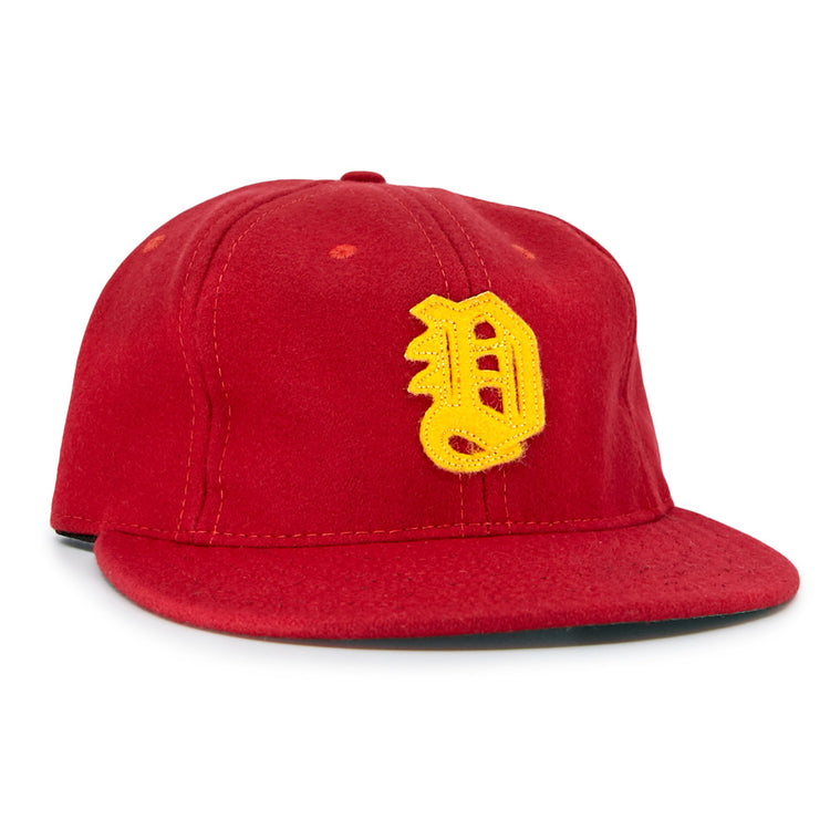 The EFF Daiei Stars 1949 Vintage Ballcap is a red, Nippon Professional Baseball-style hat with a structured crown, flat brim, and large yellow embroidered D on the front.