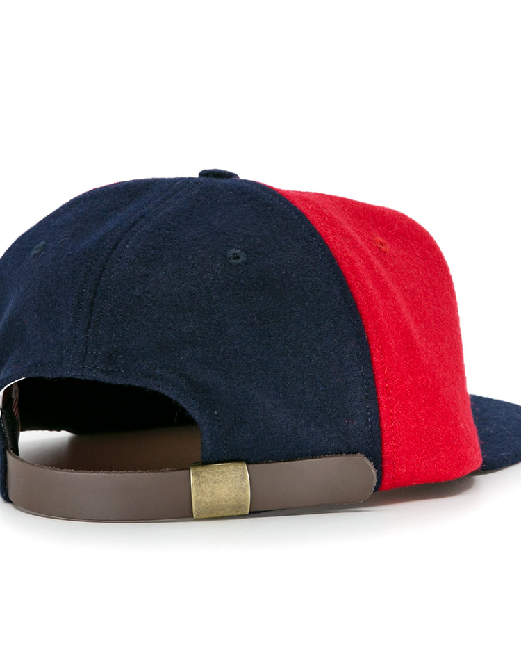 EFF Denver Bears 1983 Vintage Ballcap in navy blue and red wool, shown from the back with a brown leather strap and brass buckle for size adjustment. Classic two-tone design, made in the USA.