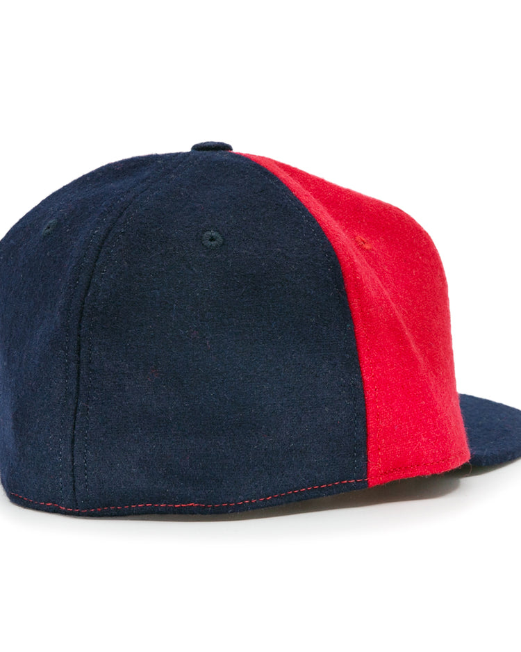 The Denver Bears 1983 Vintage Ballcap by EFF features alternating navy blue and red wool panels with a flat brim. Shown from the back and side, this classic USA-made cap captures true vintage style.