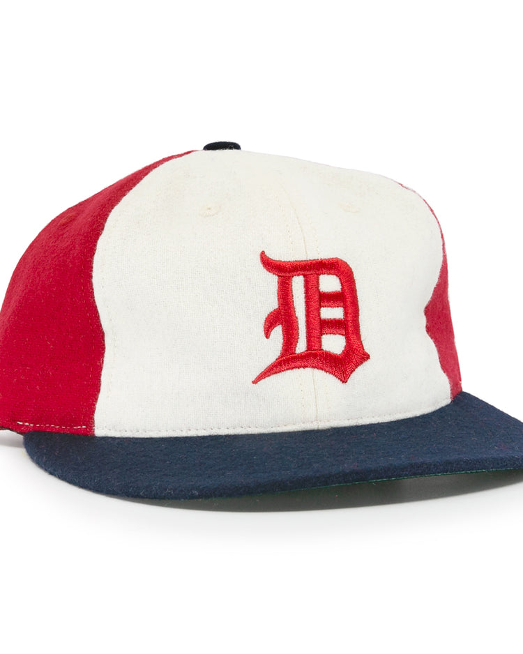 The EFF Denver Bears 1983 Vintage Ballcap features a wool design with a white front panel, red sides, and dark blue brim, plus a vintage-style red embroidered D inspired by the classic Denver Bears cap.