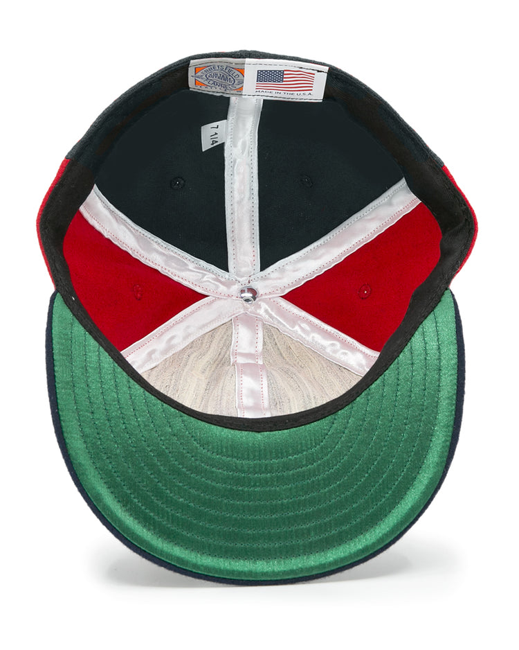 The EFF Denver Bears 1983 Vintage Ballcap features a green brim, red and black panels, white lining, and an American flag label under the crown—an authentic reproduction for vintage baseball fans.