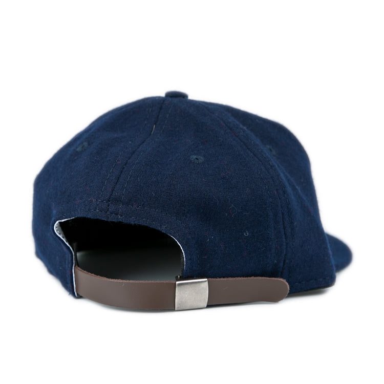 The University of Mississippi 1969 Vintage Ballcap by Ebbets Field Flannels, in navy wool, is shown from the back with a brown adjustable strap and silver buckle, set against a white background.
