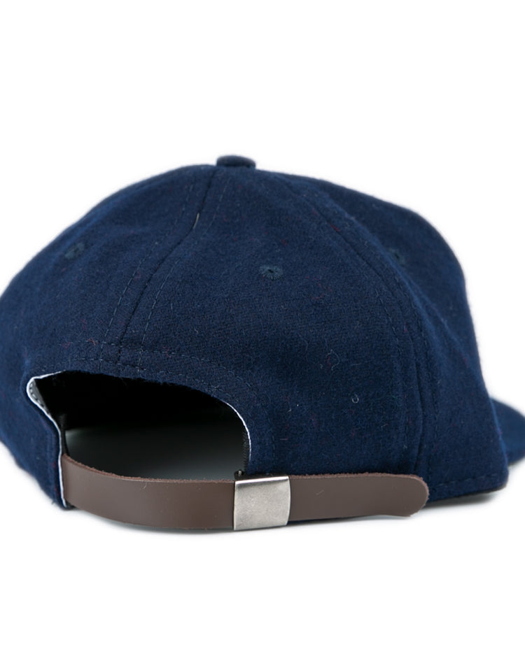 The University of Mississippi 1969 Vintage Ballcap by Ebbets Field Flannels, in navy wool, is shown from the back with a brown adjustable strap and silver buckle, set against a white background.