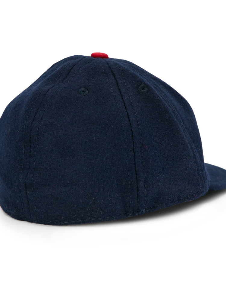 The EFF Houston Buffs 1932 Vintage 8-Panel Ballcap is a dark blue wool cap, shown from the back and side, with a red top button and visible panel stitching inspired by classic 1932 designs.