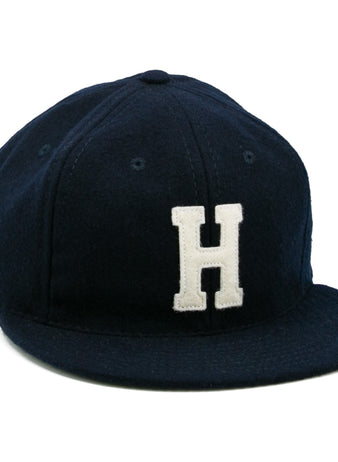The EFF Howard University 1960 Vintage Ballcap is a dark blue cap with a white embroidered H on the front—ideal for fans after a classic collegiate look.