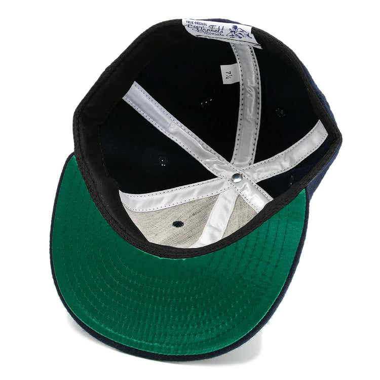 The EFF Howard University 1960 Vintage Ballcap features a green underbrim, white stitched seams, a white size 7 1/4 tag, and a black sweatband lining the inside.
