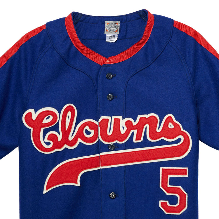 The EFF Indianapolis Clowns 1952 Road Jersey is blue with red accents, “Clowns” in script and the number 5 on the front—a tribute to Henry Aaron’s legendary Negro Leagues team.