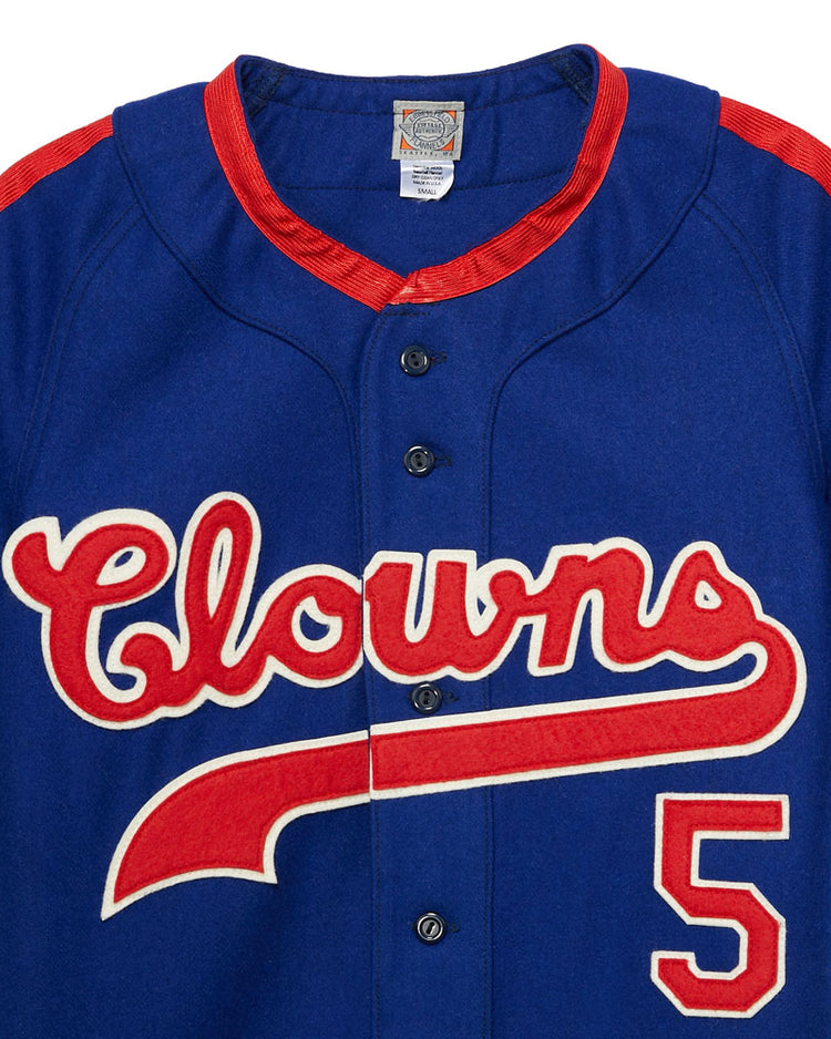 The EFF Indianapolis Clowns 1952 Road Jersey is blue with red accents, “Clowns” in script and the number 5 on the front—a tribute to Henry Aaron’s legendary Negro Leagues team.