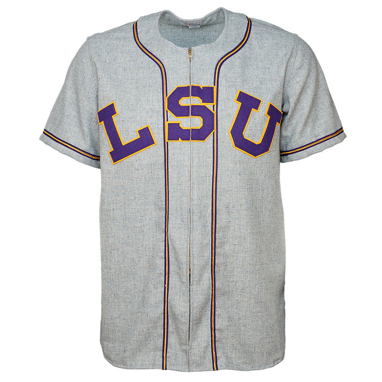 The EFF Louisiana State University 1954 Home Jersey is a gray short-sleeve baseball jersey with purple and gold lettering, black-trimmed piping, and an authentic design inspired by College World Series champions.
