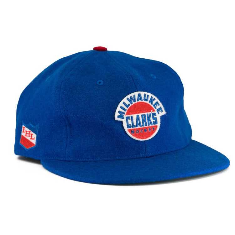 The EFF Milwaukee Clarks Vintage Ballcap is a blue wool cap with Milwaukee Clarks Hockey embroidered on the front and an IHL patch on the side—ideal for hockey fans and collectors.