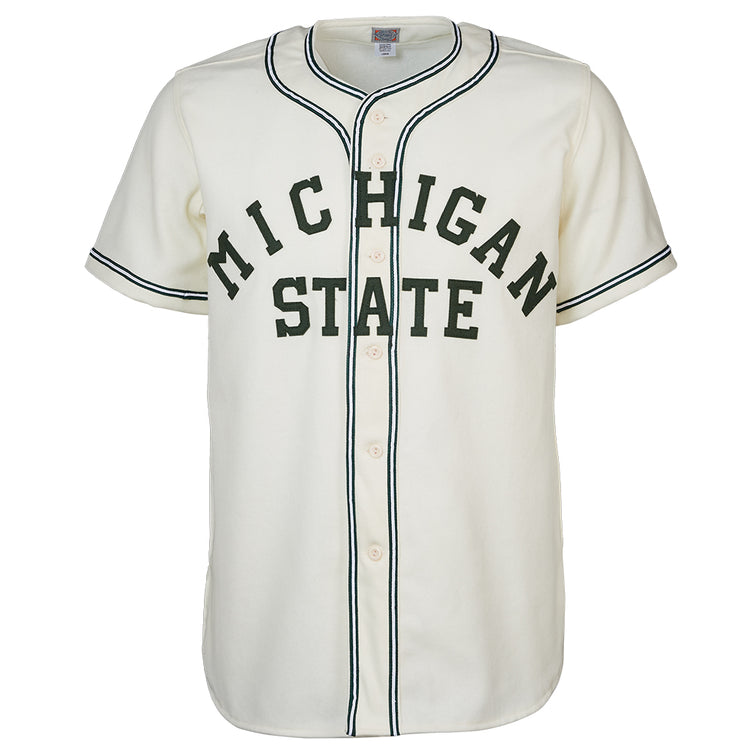 The EFF Michigan State 1940 Home Jersey is a white baseball jersey with black trim, front buttons, and MICHIGAN STATE in large dark green letters across the chest for a vintage collegiate look.