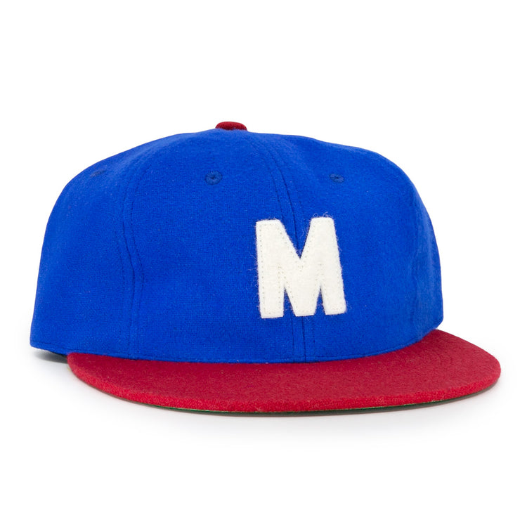 The EFF Montreal Royals 1935 Vintage Ballcap features a blue crown, red brim, and a large white M on the front, inspired by the classic 1935 team design.