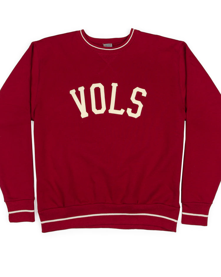 The Nashville Vols Vintage Crewneck Sweatshirt by EFF is a red USA-made top with VOLS in bold white letters across the chest and crisp white trim on the collar, cuffs, and waistband.