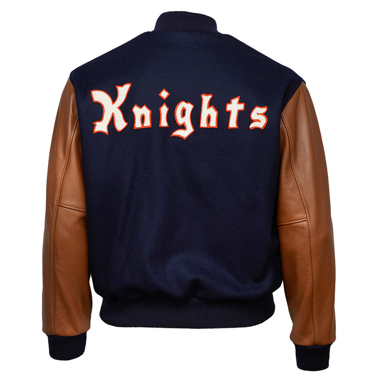 The EFF New York Knights 1939 Authentic Jacket features brown leather sleeves and a navy blue melton wool back with Knights boldly displayed in large orange and white letters across the back.