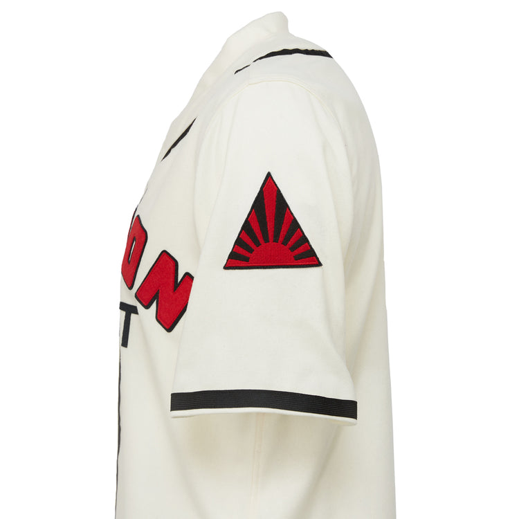 The EFF Nippon Giants 1938 Home Jersey is a vintage-style white jersey with black trim, bold red and black front text, and a red rising sun patch in a triangle on the left sleeve, inspired by classic Japanese baseball.