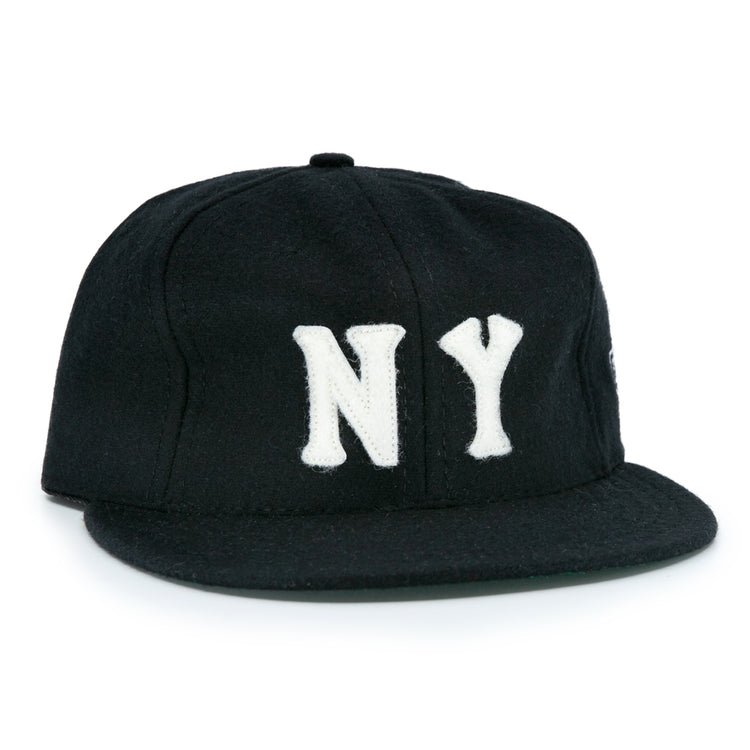 The EFF New York Black Yankees Vintage Inspired Ballcap is a black hat featuring bold white NY letters on the front, offering a classic vintage look.