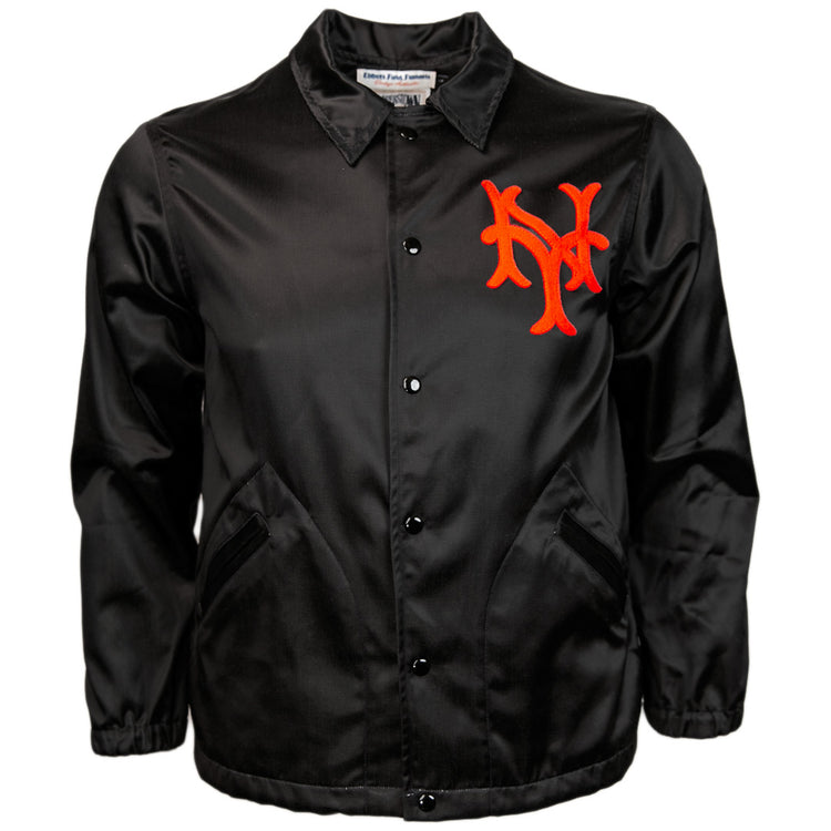 The EFF New York Giants 1954 Satin Windbreaker is a black vintage-style baseball jacket with pockets and a bold red interlocking NY logo on the left chest.
