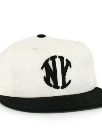 The EFF New York Knickerbockers Vintage Inspired Ballcap features a white crown, black brim, and black embroidered NY logo—a classic look for vintage baseball hat fans.