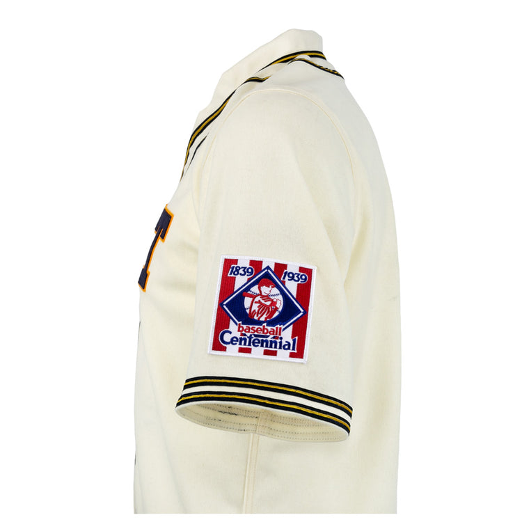 The EFF University of Pittsburgh 1939 Jersey is a cream authentic reproduction with black and yellow trim and a Baseball Centennial 1839-1939 patch on the left sleeve—ideal for collegiate baseball fans and collectors.