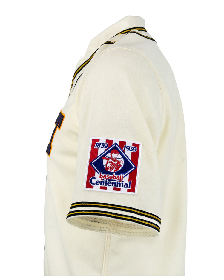 The EFF University of Pittsburgh 1939 Jersey is a cream authentic reproduction with black and yellow trim and a Baseball Centennial 1839-1939 patch on the left sleeve—ideal for collegiate baseball fans and collectors.