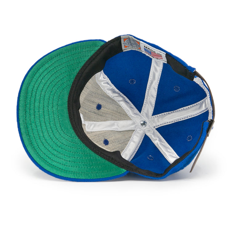 The EFF Puerto Rico Marlins 1961 Vintage Ballcap is shown from underneath, featuring a green underbrim, white lining, blue panels with ventilation holes, and a visible Made in USA label.