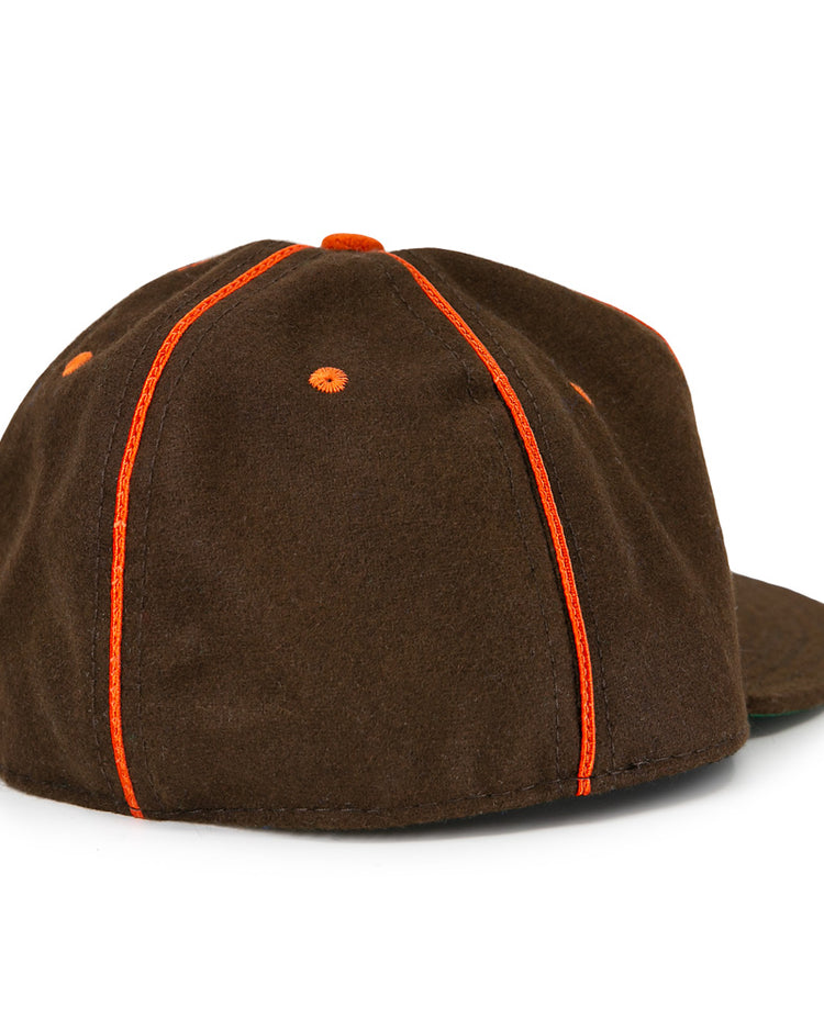 The EFF San Antonio Missions 1939 Vintage Ballcap is dark brown with orange stitching and eyelets, seen from the back and side. It features a flat brim, no visible logo or strap, reflecting classic 1939 style.