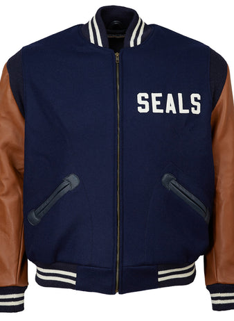 The EFF San Francisco Seals 1949 Authentic Jacket features navy blue wool, brown leather sleeves, black pockets, white stripes on the collar, cuffs and waistband, and “SEALS” in white on the left chest.