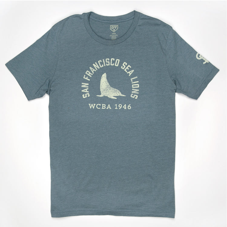 The EFF San Francisco Sea Lions 1946 T-Shirt is a unisex premium cotton heathered tee in blue, featuring white San Francisco Sea Lions WCBA 1946 text and a central sea lion graphic, inspired by the West Coast Baseball Association.