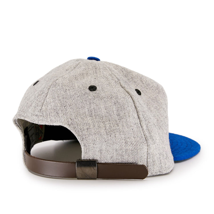 The EFF St. Louis Stars 1929 Vintage Ballcap features a gray crown, blue brim, black eyelets, and a brown adjustable strap with a black buckle, shown from the back and inspired by classic Negro National League style.