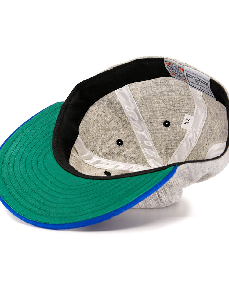 The EFF St. Louis Stars 1929 Vintage Ballcap, inspired by the Negro National League era, features a green and blue brim, black inner band, white stitched lining, and a size tag marked 7 1/4.