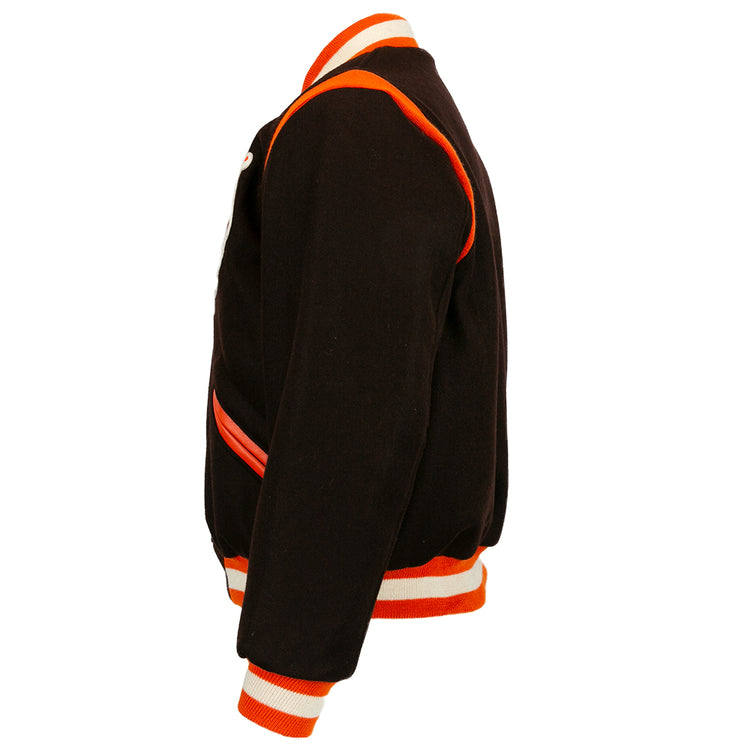 Side view of the EFF St. Louis Browns 1952 Authentic Jacket in black wool, featuring orange and white striped cuffs, collar, waistband, and orange trim along seams and pockets.