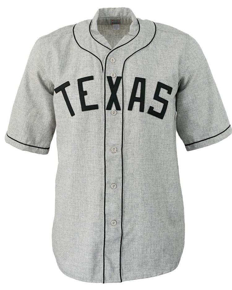 The EFF Texas Black Spiders 1938 Road Jersey is a gray button-up with black piping and TEXAS in bold black letters, authentically reproducing the historic barnstorming teams look and celebrating baseball heritage.