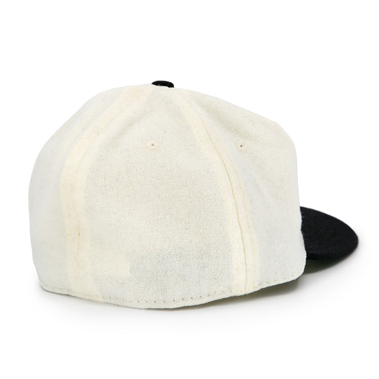 The Tokyo Kyojin (Giants) 1948 Vintage Ballcap by Ebbets Field Flannels features an off-white crown, black brim, visible stitching, and an authentic wool design without logos or an adjustable strap. Shown from the back.