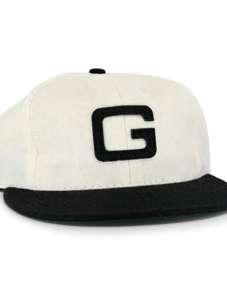 The Tokyo Kyojin (Giants) 1948 Vintage Ballcap by Ebbets Field Flannels features a white crown, black brim, and bold black G on the front, inspired by an authentic 1948 Japanese baseball cap.